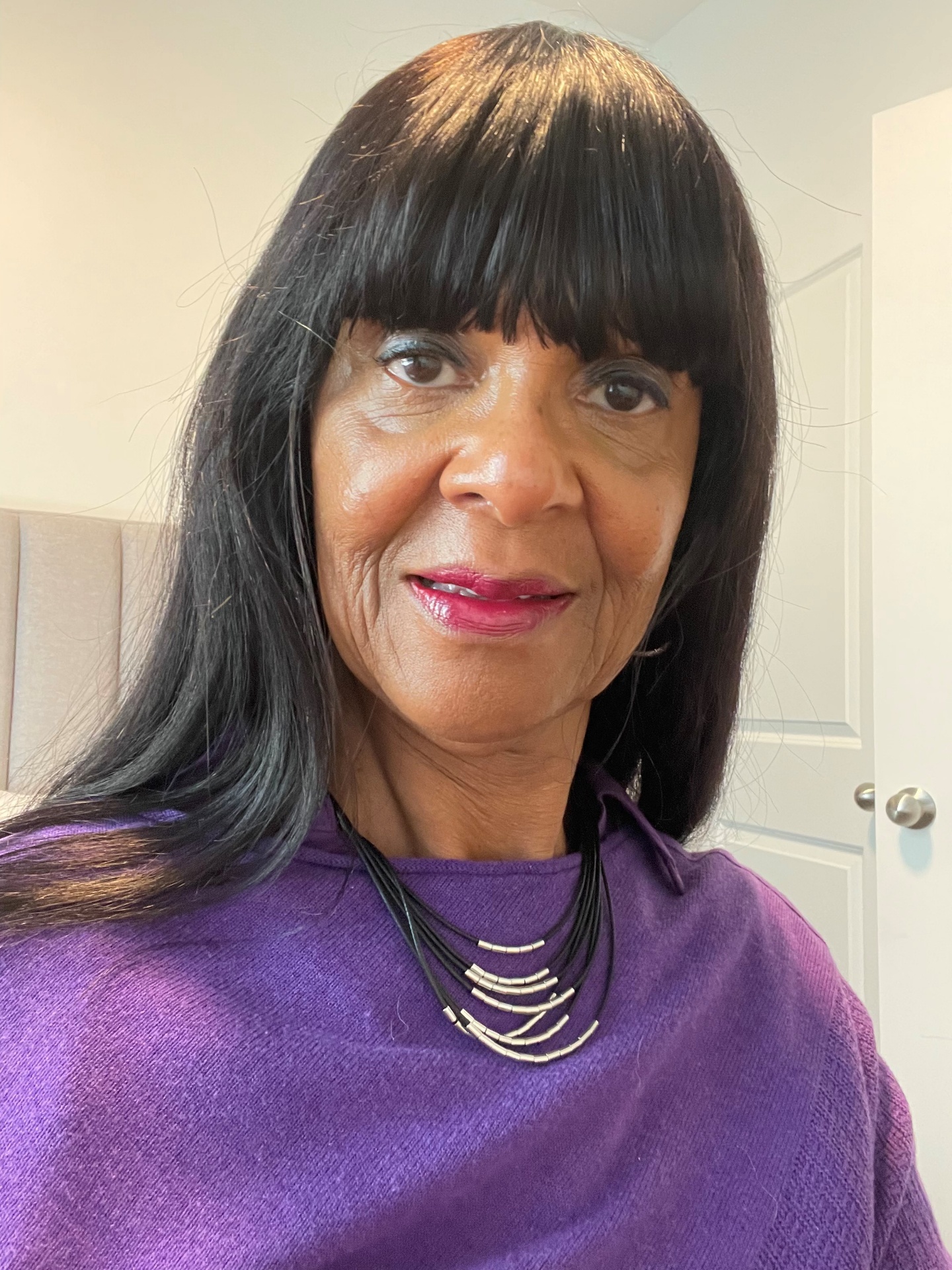 Marva L. Dowdin in a purple sweater
